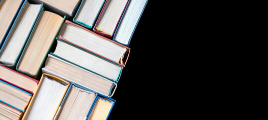 Banner with book stacks on black. Copy space. Abstract pattern. Education background. Back to...