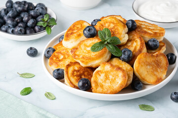 Homemade mini pancakes with blueberries