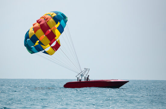 Boat with a parachute in the sea