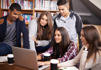 University, friends and people in library on laptop for online research, studying and learning. Education, academy and happy men and women students on computer for knowledge, internet and website