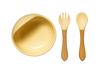 Silicone dishware on grey background. Serving baby, first feeding concept. Baby food accessory