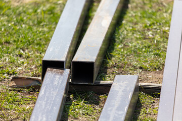 Steel pipes on the construction site. Selective focus, shallow depth of field