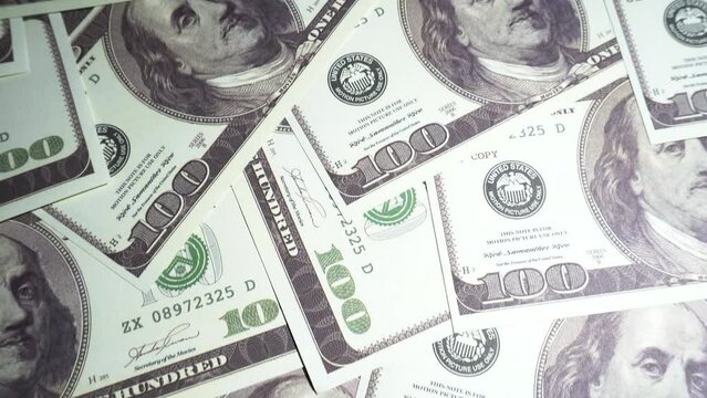 US American Dollar Bills Money - Camera flying Close up over stacked &ndash; $100 Banknotes