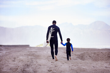 Beach, father and son with surfing lesson, walking and bonding on summer vacation, loving and...