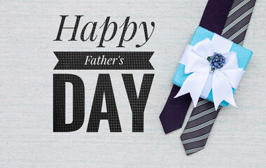 Fototapeta na wymiar Happy father's day card background idea, father's day banner with Gift box on design necktie on canvas fabric texture background
