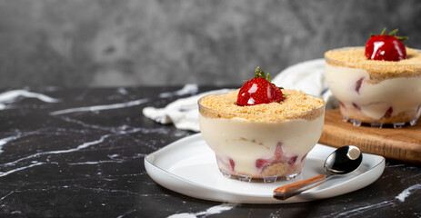 Strawberry magnolia. Magnolia dessert in bowl with cream and strawberry. Copy space. Empty space for text