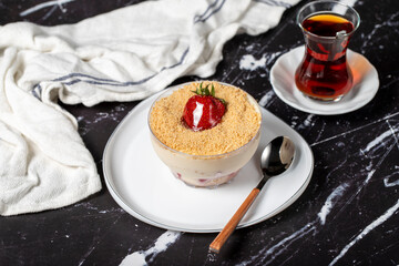 Strawberry magnolia. Magnolia dessert in bowl with cream and strawberry