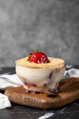 Strawberry magnolia. Magnolia dessert in bowl with cream and strawberry. Close up