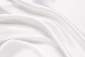 Abstract white fabric texture background. Cloth soft wave. Creases of satin, silk, and cotton.