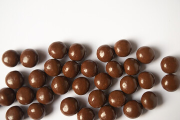sweet chocolate balls on a white background
