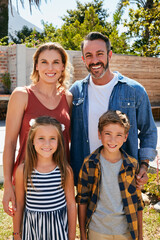 Were family and that means we stick together. Portrait of a happy young family spending quality time in their backyard at home.