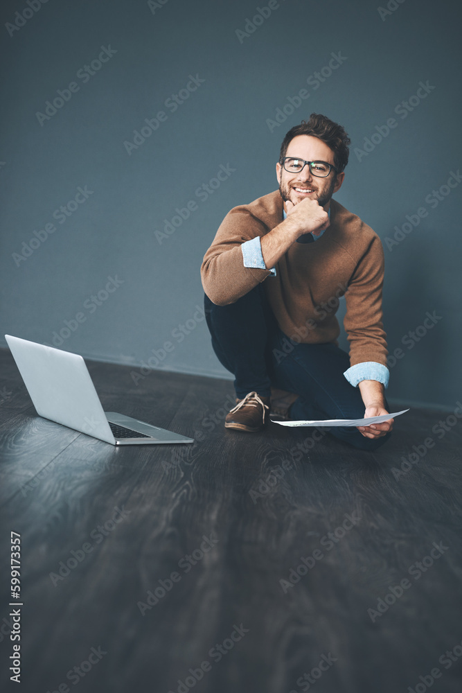 Aufkleber How you approach work is up to you. Studio shot of a young businessman working on a laptop against a grey background.