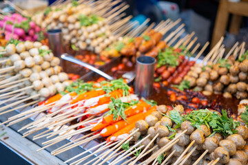 grilled meatball and sausage with spicy sauce