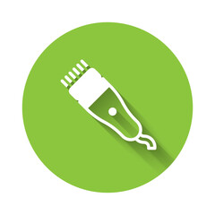 White Electrical hair clipper or shaver icon isolated with long shadow. Barbershop symbol. Green circle button. Vector