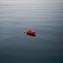 small red boat on the sea