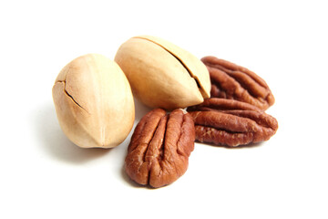 Pecan nut in shell and peeled pecan seed isolated on a white background