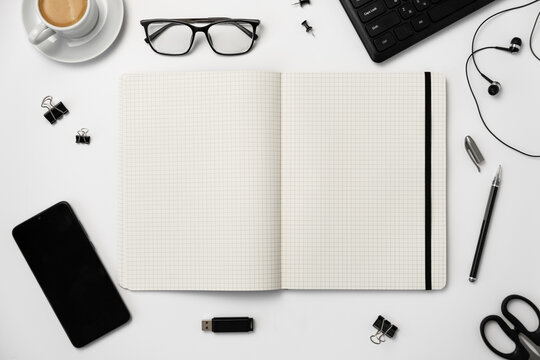 Planning, business, office work, stationery, or an education concept: on top is an image of an open notebook with a blank page, ready for addition or layout. flatlay. Minimalism