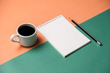 Planning, business, office work, stationery, or an education concept: on top is an image of an open notebook with a blank page, ready for addition or layout. Top view of stationery