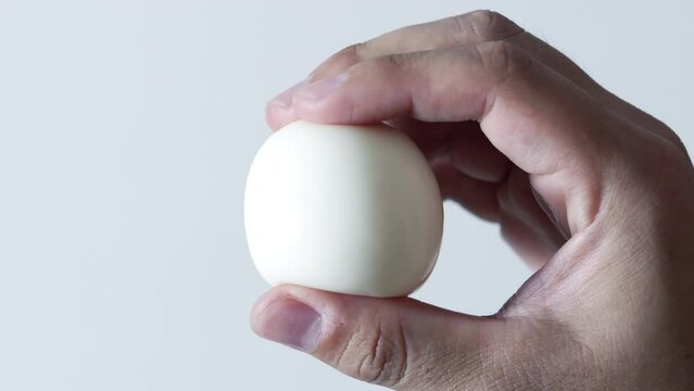 Kneading a boiled egg with a hand, Skin care or make up image, Protein or health, Nobody