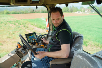 A photograph of a farmer using a tractor and other farming equipment to manage the fields and maximize agricultural productivity. The image showcases the importance of field management and the use of