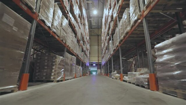 Very large warehouse with high shelves. Large warehouse with goods. Inside a large warehouse. Modern warehouse