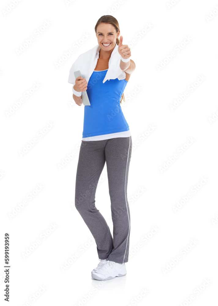 Wall mural Staying in shape thanks to a handy fitness app. Fit young woman giving you a thumbs up against a white background while holding a tablet.