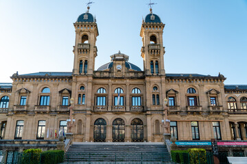 Fototapeta premium San Sebastian, SPAIN - July 09 2022 Streets of San Sebastian - Donostia. View of Town Hall building. Famous travel destination in north of Spain. 