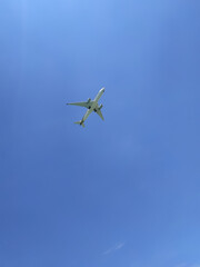 airplane making a landing passing by overhead