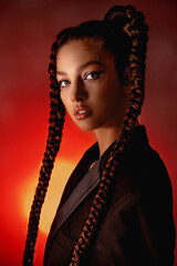 Portrait, girl with braids, beautiful glamorous woman, neon light shines on her