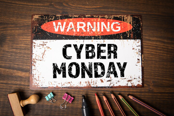 Cyber Monday. Warning sign with text on wood texture background