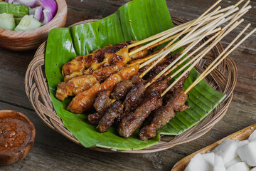 Grilled food chicken and beef satay eaten with peanut sauce is famous Malaysian and Indonesian local dishes