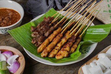 Grilled food chicken and beef satay eaten with peanut sauce is famous Malaysian and Indonesian local dishes