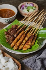 Grilled food chicken and beef satay eaten with peanut sauce is famous Malaysian and Indonesian local dishes