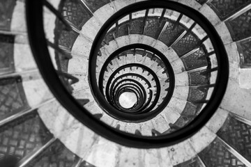 Old vintage spiral staircase. Black and white photography.