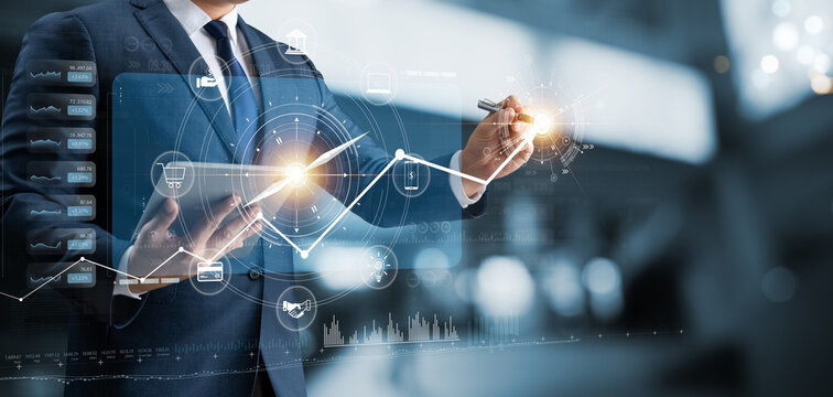 Businessman using tablet analyzing business growth graph data and progress, compass of navigate guiding market direction. Investment, banking and finance, business strategy. Global economy.