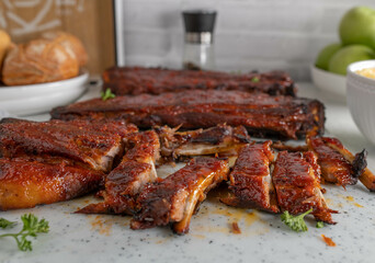 Honey glazed barbecue pork ribs on a cutting board