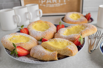 Yeast pastry with sour cream, pudding filling on a platter