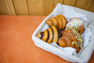 four types of croissants in a basket