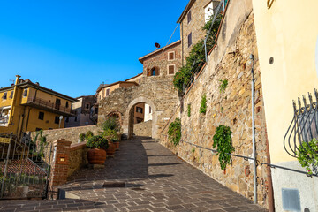 Fototapeta na wymiar Porta Pisana gate in the medieval walls of Scarlino built in the 11th century, province of Grosseto, Tuscany region, Italy