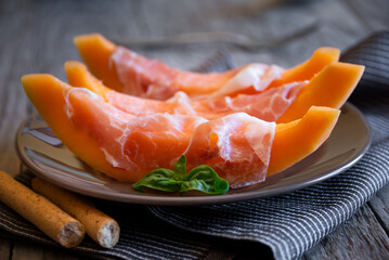 Prosciutto ham with melon, traditional italian dish