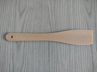 Wooden kitchen spatula on the table