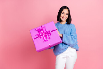 Photo of cheerful gorgeous girl arms hold receive giftbox toothy smile isolated on pink color background