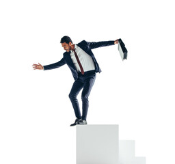 Young businessman jumping off a block of stairs on a transparent background