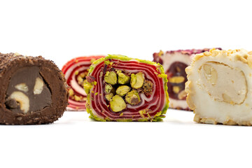 Turkish delight. Assortment of turkish delight with pistachio and hazelnut isolated on white background.