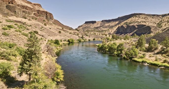 Deschutes River Oregon Aerial v64 low flyover Deschutes River Frog Springs Canyon capturing recreational campgrounds and people fly fishing in the stream - Shot with Mavic 3 Cine - August 2022