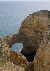 Wonderful landscapes in Portugal. Scenic and coloured view of Ponta da Piedade in the Algarve region. Yellow rocky skerries. Sunny spring day. Selective focus