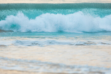 Fototapeta premium Blue textured waves break on the Indian Ocean beach—Sri Lanka island.