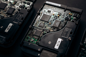 Fototapeta premium Computer disassembled HDD hard drive data disc SSD, backup part of the PC or laptop. Recovery, fixing technology maintenance work, access file. Engineer profession repairman 