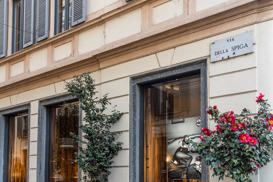 Street sign pointing at "Via della Spiga", famous street of luxury fashion brands and stores in Milan city center, Lombardy region, Italy