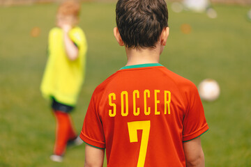 Little Soccer Boy in Red Jersey T-shirt. Schoolboy Soccer Shirt. Children Play Sports Match Outdoor. School Kid in Red Soccer Uniform